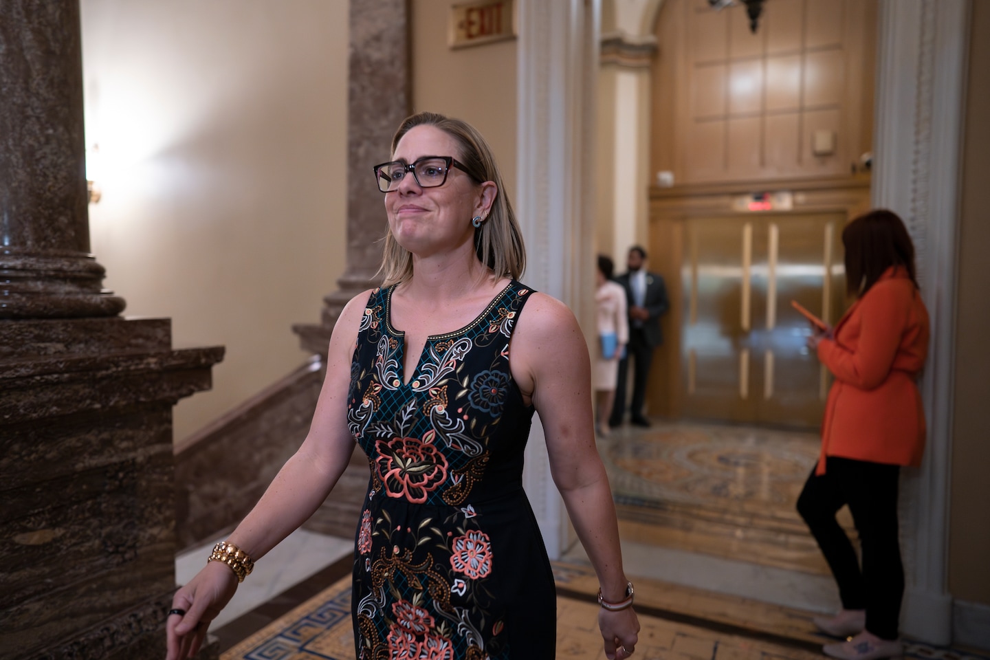 Sinema cites a bill targeting leaders of failed banks after criticism of Wall Street relations.