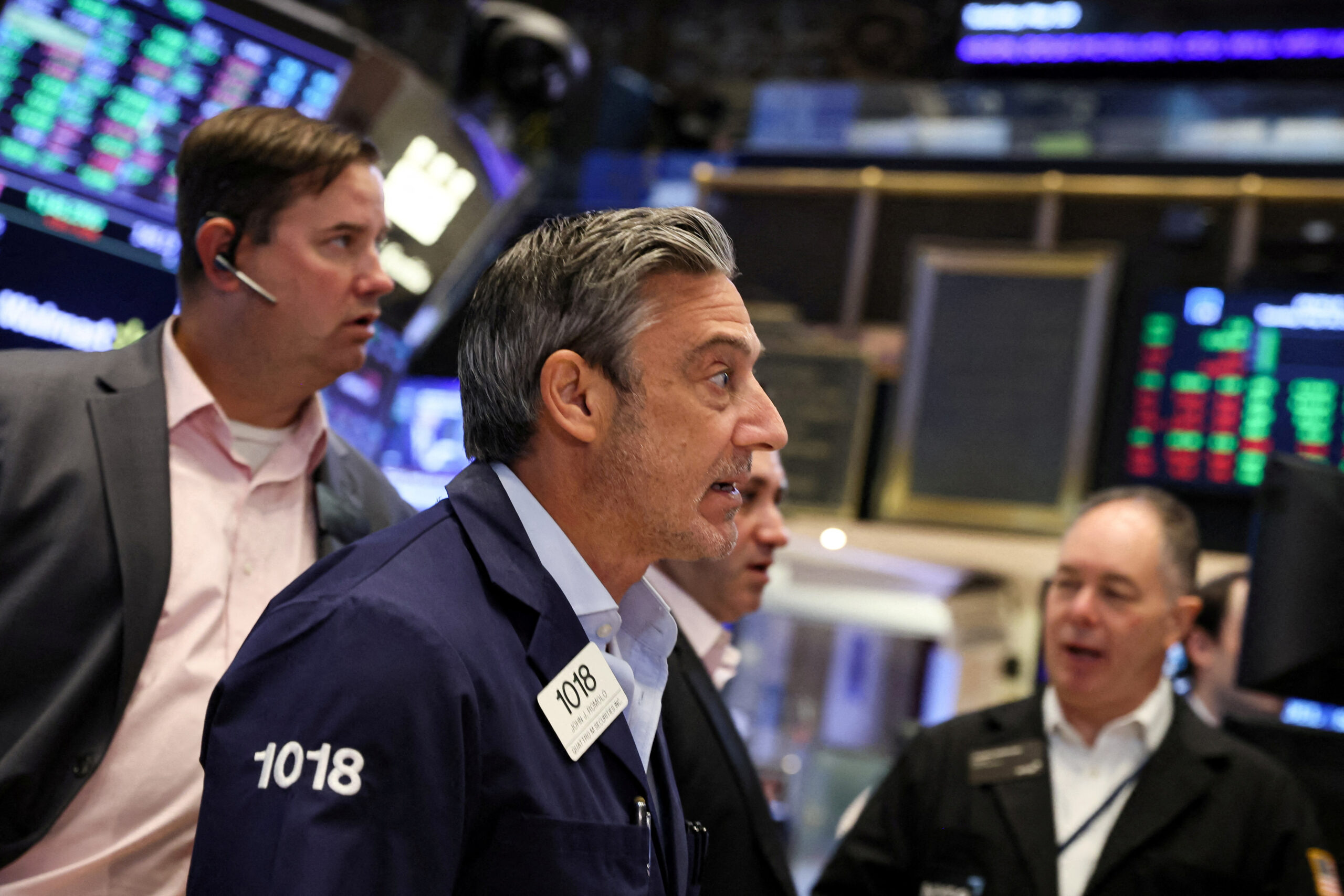 Traders work on the NYSE floor in New York.